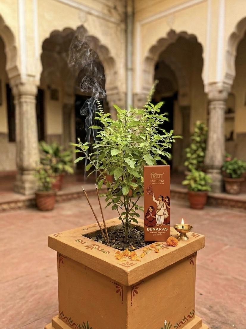Benaras incense sticks in traditional Indian courtyard with tulsi